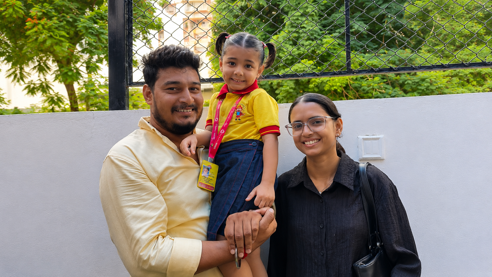 Parents with their daughter in Shanti Juniors uniform